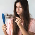 Young slim woman enjoys weight loss result